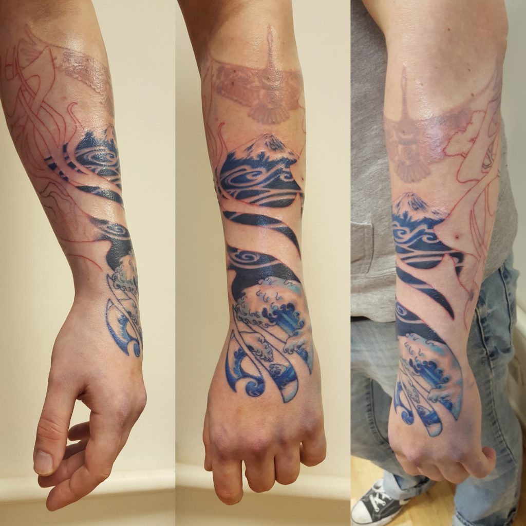 Photo of a Japanese-style sleeve, based on the elements fire, water, earth and sky. Designed and tattooed by Naomi Hoang at NAOHOA Luxury Bespoke Tattoos, Cardiff (Wales, UK).