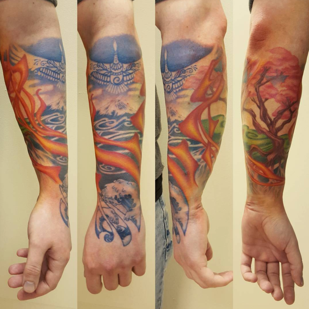 Photo of a Japanese-style sleeve, based on the elements fire, water, earth and sky. Designed and tattooed by Naomi Hoang at NAOHOA Luxury Bespoke Tattoos, Cardiff (Wales, UK).