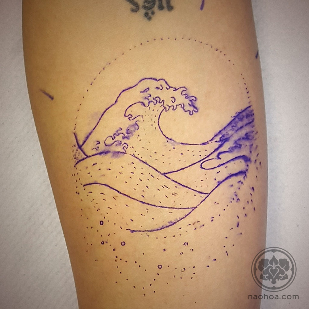 Photo of a tattoo stencil, featuring the Hokusai wave, applied to a client's skin at NAOHOA Luxury Bespoke Tattoos, Cardiff (Wales, UK).