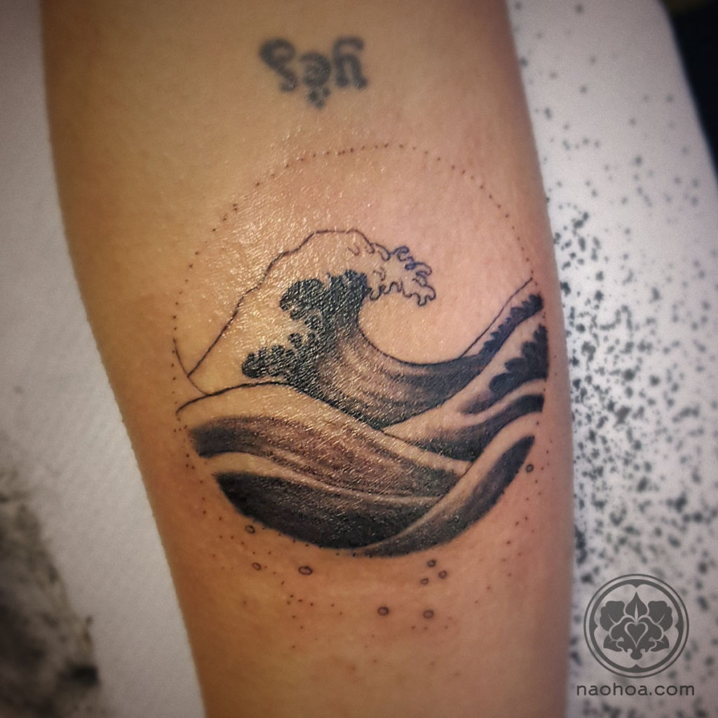 Work-in-progress shot of an arm tattoo featuring the Hokusai wave, at NAOHOA Luxury Bespoke Tattoos, Cardiff (Wales, UK).
