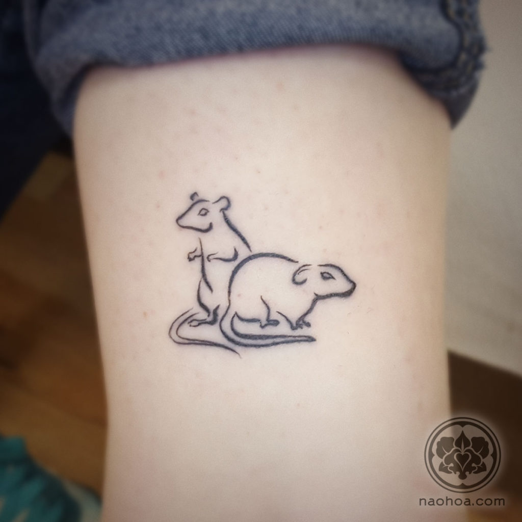 Photo of a healed tattoo of two rats in a minimalistic line art style. Designed and tattooed by Naomi Hoang at NAOHOA Luxury Bespoke Tattoos, Cardiff, Wales, UK.