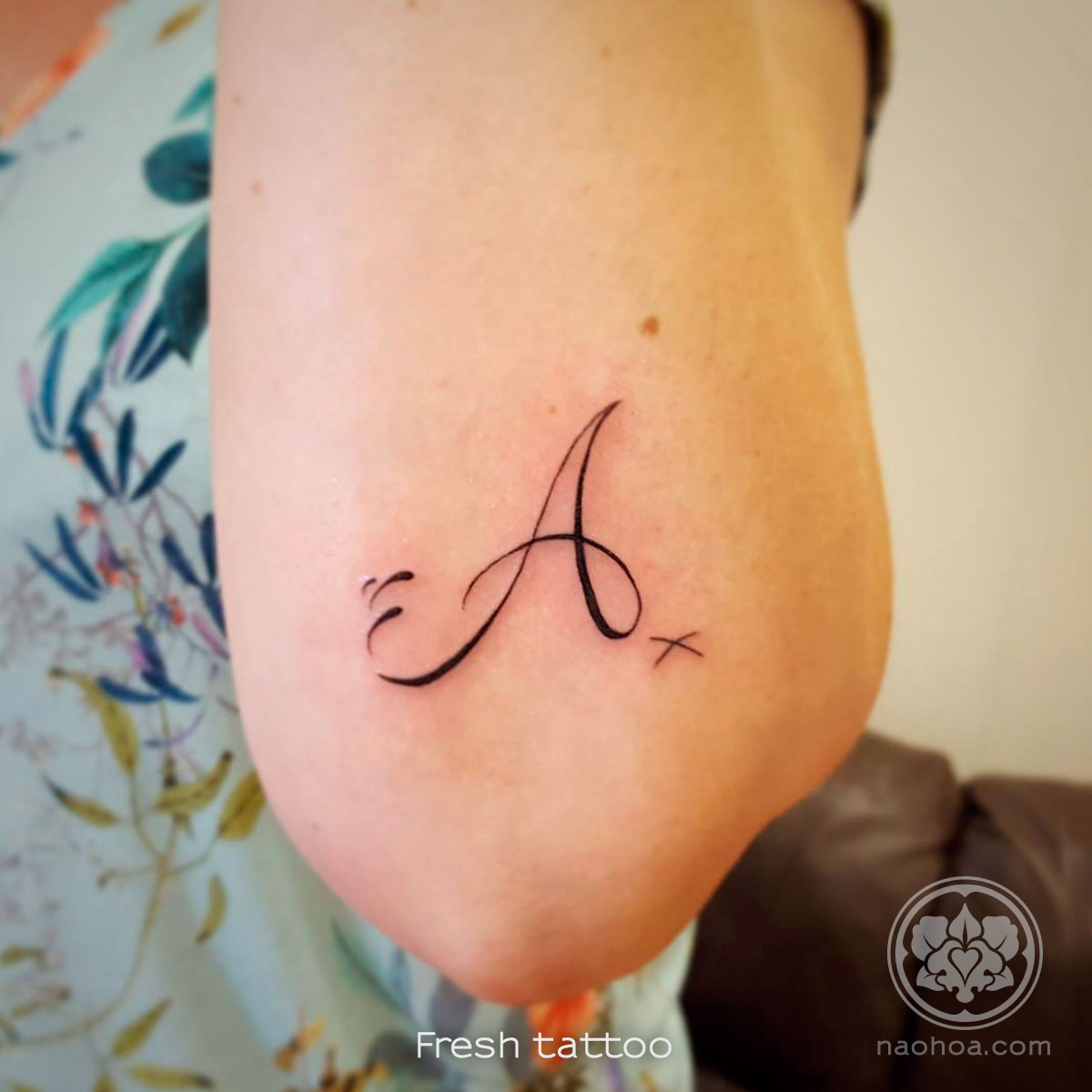 Tattoo of the letter 'A' for the first name of this client's child. Designed and tattooed by Naomi Hoang at NAOHOA Luxury Bespoke Tattoos, Cardiff (Wales, UK).