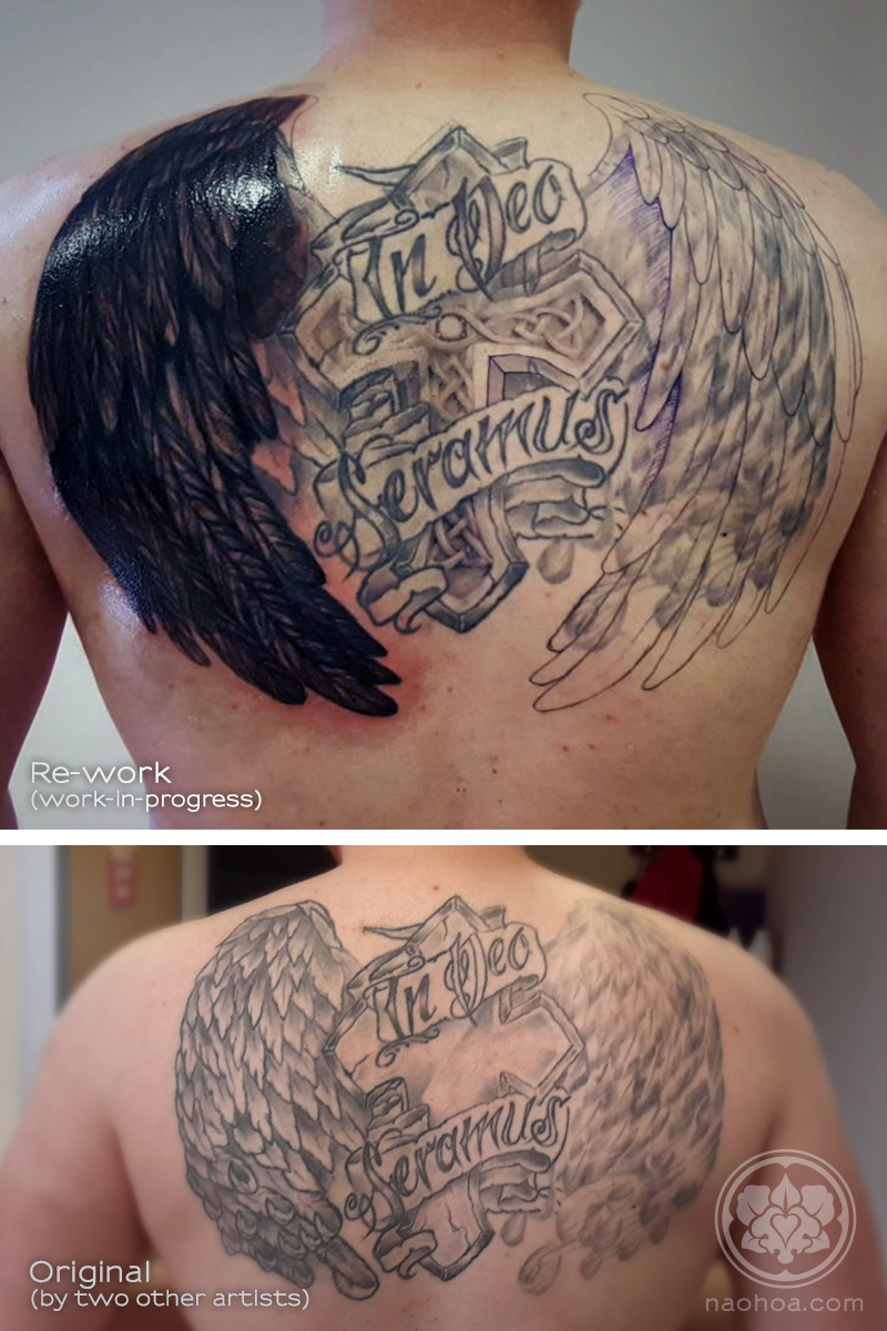 A work-in-progress shot of a large back tattoo containing a Christian cross, a pair of wings and the saying, "In dec seramus".