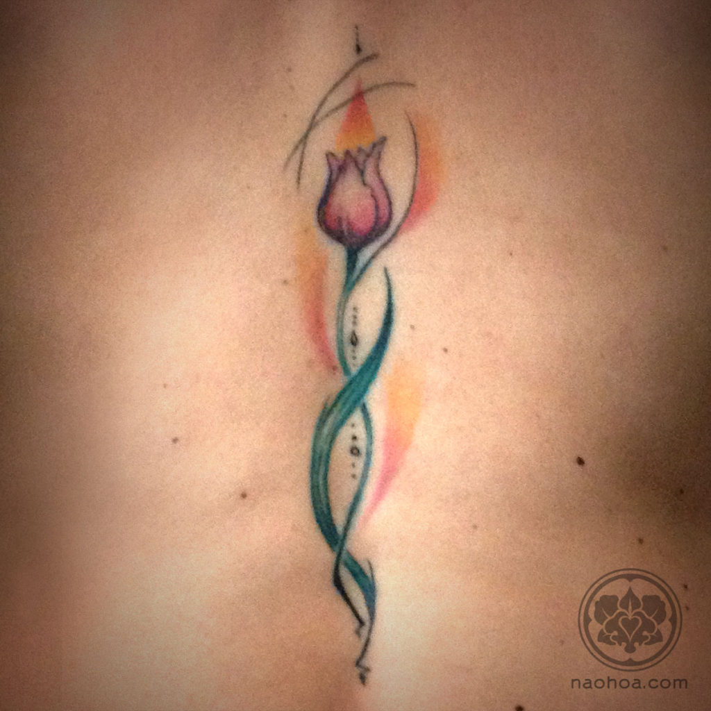 Healed back tattoo of a geometric tulip. Designed and inked at NAOHOA Luxury Bespoke Tattoos (Cardiff, Wales, UK) by Naomi Hoang.